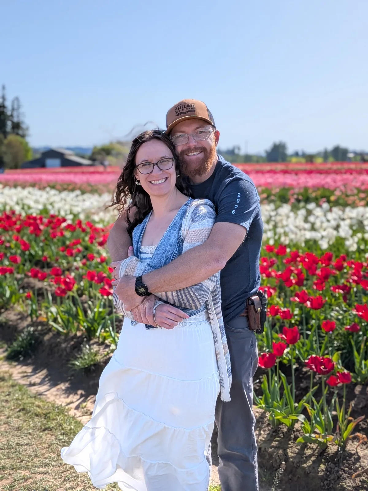 Chase and Stephanie Cohrac together in a field of flowers